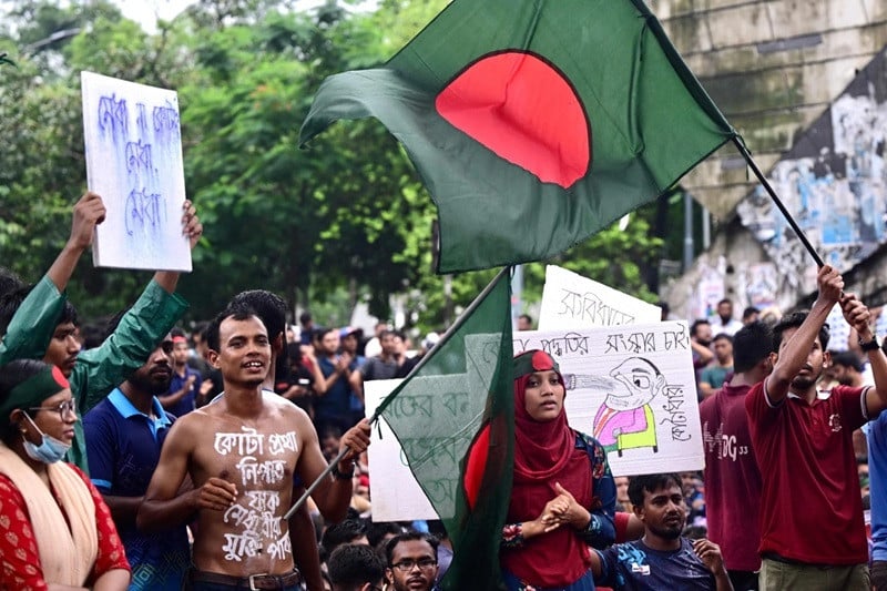 students and job aspirants hold placards during a protest in dhaka on july 4 against discriminatory quotas for government jobs photo afp