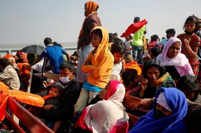 rohingya refugees sit on wooden benches of a navy vessel on their way to the bhasan char island in noakhali district bangladesh december 29 2020 photo reuters rohingya refugees sit on wooden benches of a navy vessel on their way to the bhasan char island in noakhali district bangladesh december 29 2020 photo reuters
