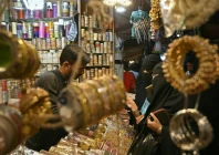 customers buy bangles at a shop photo afp