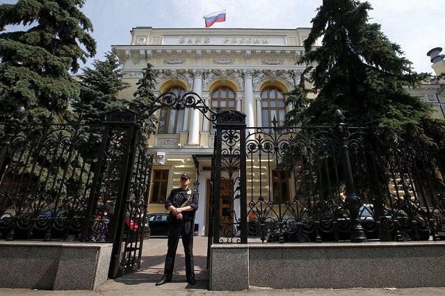 a policeman stands guard at the main entrance to the bank of russia in moscow russia june 15 2015 photo reuters a policeman stands guard at the main entrance to the bank of russia in moscow russia june 15 2015 photo reuters