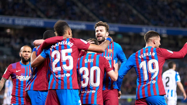 aubameyang gives barca narrow win
