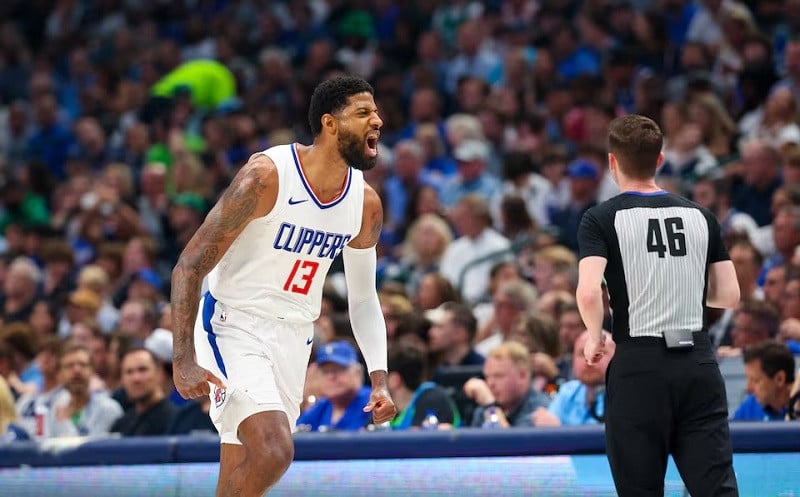LA Clippers forward Paul George reacts after scoring during the first quarter against the Dallas Mavericks. PHOTO: REUTERS