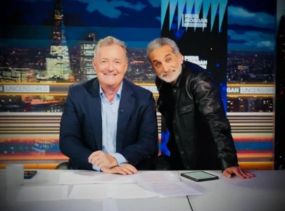 bassem youssef sparks backlash for friendly pose with piers morgan amid gaza crisis