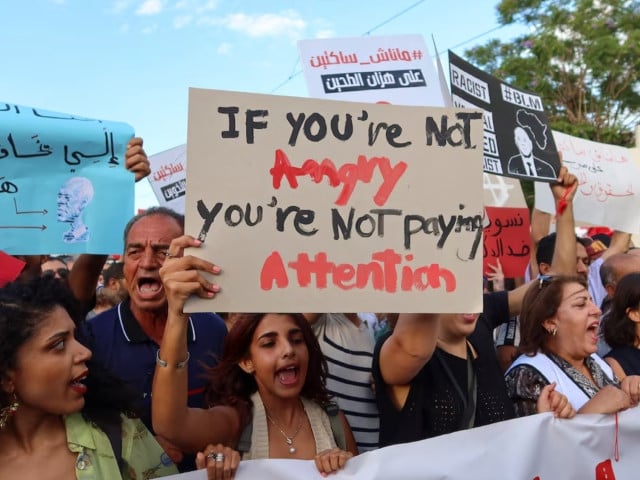 demonstrators hold signs and chant slogans during a protest against tunisia president kais saied whom they accuse of trying to rig the october 6 presidential election by detaining and intimidating his rivals in tunis tunisia september 13 2024 photo reuters