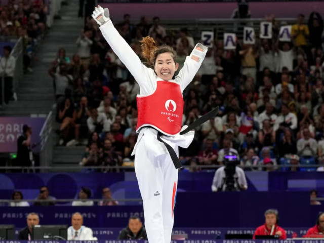 paris 2024 paralympics   taekwondo   women k44  47kg repechage   grand palais paris france   august 29 2024 zakia khudadadi of refugee paralympic team celebrates winning her fight against nurcihan ekinci of turkey photo reuters