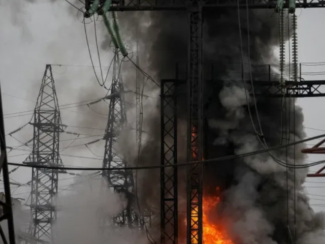 smoke and fire are seen near a high voltage line at a site of a russian missile strike outside kharkiv on march 22 2024 photo reuters