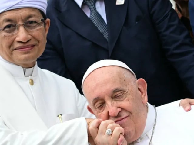 the grand imam of istiqlal mosque nasaruddin umar left with pope francis after an interreligious meeting in jakarta on september 5 photo afp