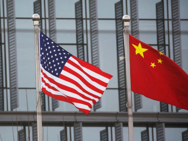 chinese and u s flags flutter outside the building of an american company in beijing china january 21 2021 photo reuters