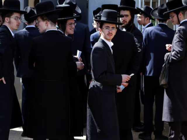 ultra orthodox jews line up at an israeli draft office to process their exemptions from mandatory military service at a recruitment base in kiryat ono israel march 28 2024 photo reuters