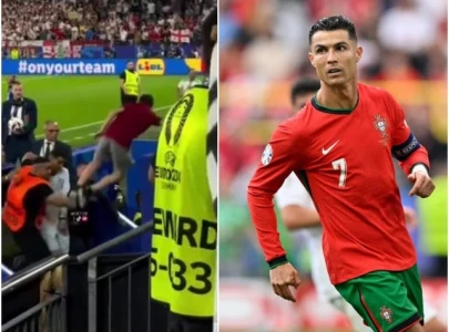 security blocks a fan s head first dive towards cristiano ronaldo at euro 2024