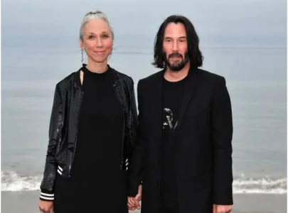 keanu reeves spotted with alexandra grant at moto gp sachsenring