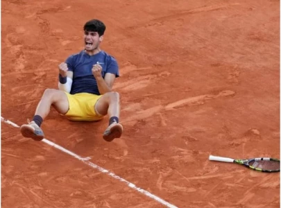 carlos alcaraz secures french open title eyes nadal and djokovic s legendary records