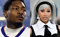 stefon diggs surprises cardi b with roses to celebrate album release and pregnancy