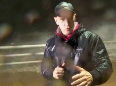 anderson cooper hit by debris during live hurricane milton broadcast continues reporting unfazed
