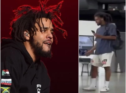 j cole ignored at tesla dealership shocking video reveals staff snubbing the rapper