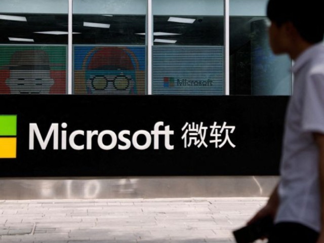a person walks past a microsoft sign at its office building in beijing china may 25 2023 photo reuters