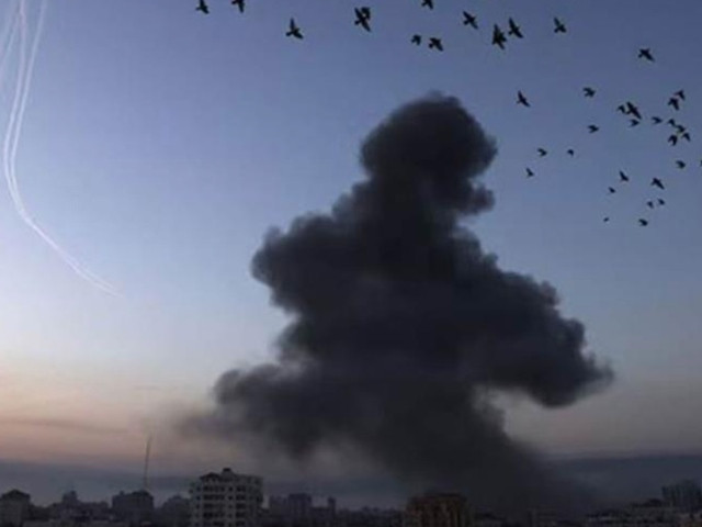 smoke rises from an israeli air strike photo afp