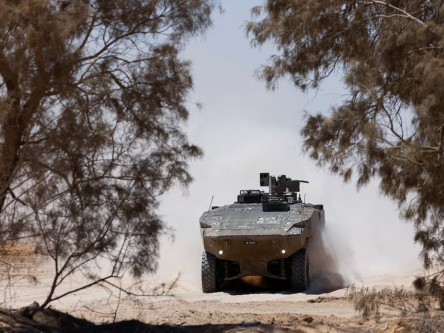 an israeli military vehicle manoeuvres near the israel gaza border amid the israel hamas conflict in israel july 10 2024 photo reuters an israeli military vehicle manoeuvres near the israel gaza border amid the israel hamas conflict in israel july 10 2024 photo reuters