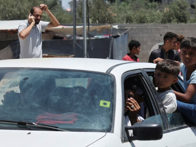 displaced palestinian children who fled north gaza after they were ordered by israeli army to move southward amid israel hamas conflict travel in a car as they arrive in nuseirat in the central gaza strip july 11 2024 photo reuters