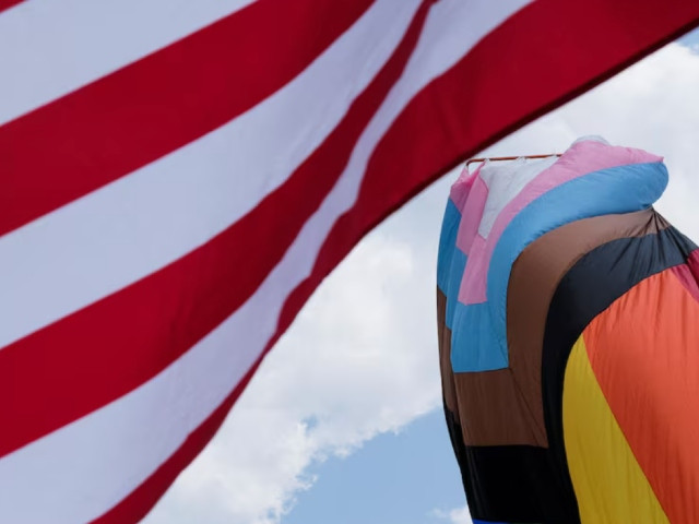 the us and rainbow flag blows in the wind during pride event in franklin tennessee u s photo reuter