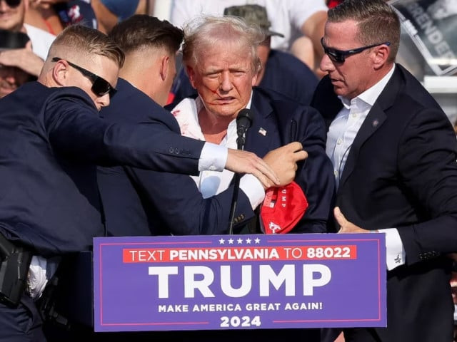 republican presidential candidate and former us president donald trump is assisted by the secret service after gunfire rang out during a campaign rally at the butler farm show in butler pennsylvania us on july 13 2024 photo reuters republican presidential candidate and former us president donald trump is assisted by the secret service after gunfire rang out during a campaign rally at the butler farm show in butler pennsylvania us on july 13 2024 photo reuters