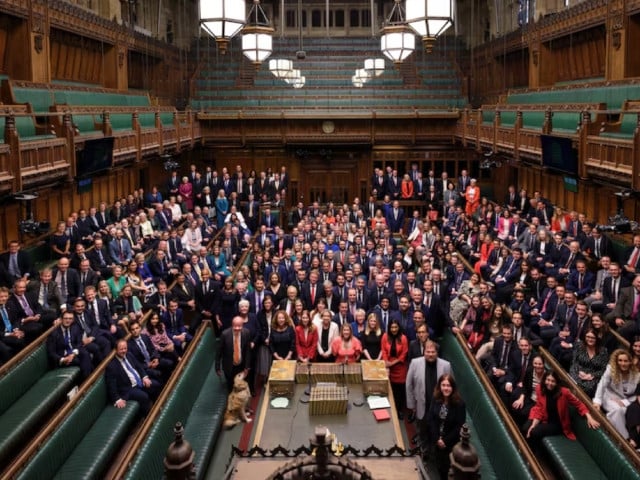 british members of parliament newly elected in the 2024 general election gather in the house of commons chamber for a group photo in london britain july 9 2024 in this handout image uk parliament handout photo via reuters
