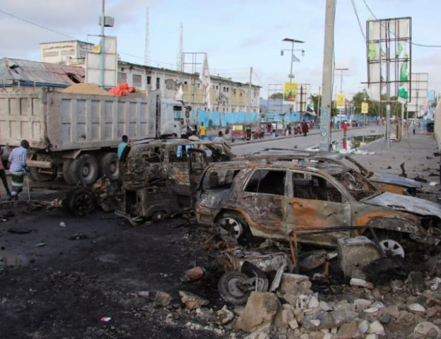 people gather near the wreckages of vehicles destroyed at the scene of an explosion outside a restaurant where patrons were watching the final of the euro 2024 football tournament on tv in bondhere district of mogadishu somalia july 15 2024 photo reuters people gather near the wreckages of vehicles destroyed at the scene of an explosion outside a restaurant where patrons were watching the final of the euro 2024 football tournament on tv in bondhere district of mogadishu somalia july 15 2024 photo reuters
