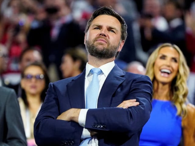 republican vice presidential nominee j d vance with rnc co chair lara trump behind him looks at the stage during day 1 of the republican national convention rnc at the fiserv forum in milwaukee wisconsin us july 15 2024 photo reuters