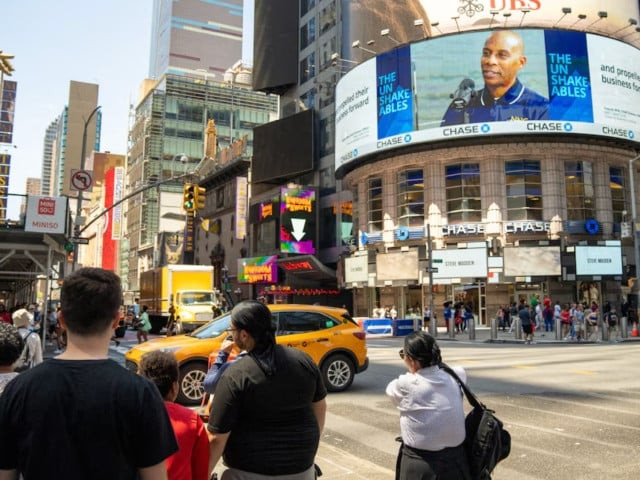 people stand near the blacked out digital billboards at times square following a global it outage in new york city us july 19 2024 photo reuters people stand near the blacked out digital billboards at times square following a global it outage in new york city us july 19 2024 photo reuters
