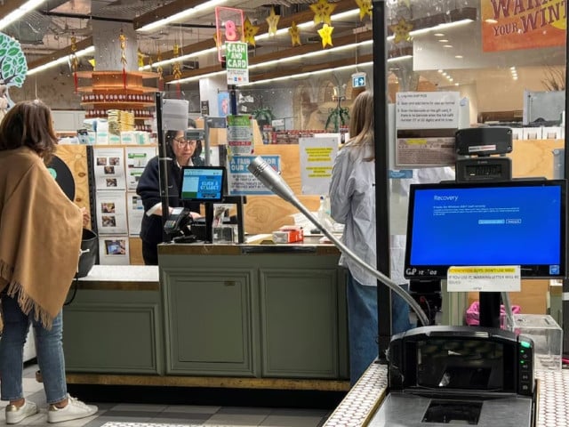 a cash register shows a blue screen at a grocery store affected by a cyber outage in sydney australia july 19 2024 photo reuters