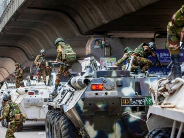 bangladesh troops disembark armoured vehicles as they patrol the streets of the capital photo afp bangladesh troops disembark armoured vehicles as they patrol the streets of the capital photo afp