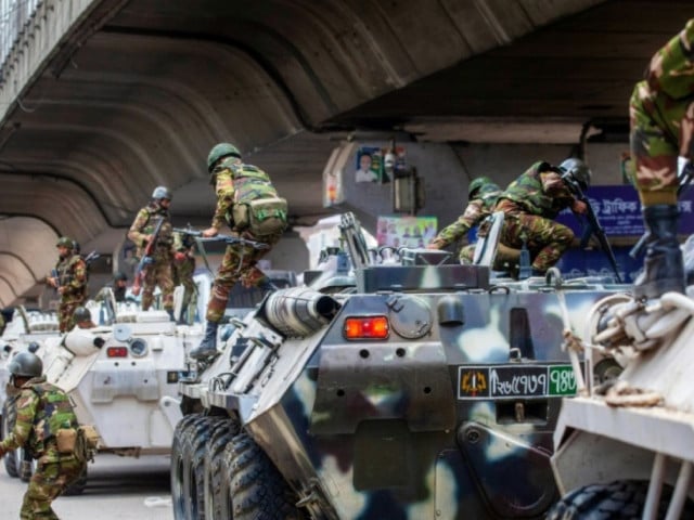 bangladesh troops disembark armoured vehicles as they patrol the streets of the capital photo afp