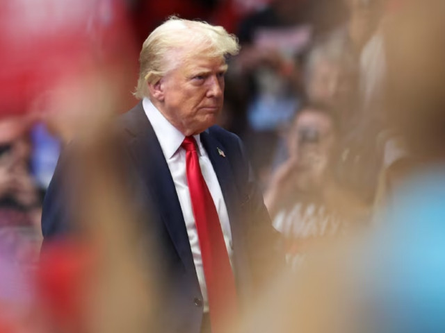 republican presidential nominee and former u s president donald trump looks on as he holds a campaign rally for the first time with his running mate republican vice presidential nominee us senator j d vance r oh in grand rapids michigan us july 20 2024 photo reuters republican presidential nominee and former u s president donald trump looks on as he holds a campaign rally for the first time with his running mate republican vice presidential nominee us senator j d vance r oh in grand rapids michigan us july 20 2024 photo reuters