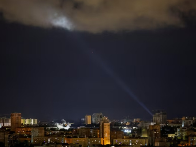 ukrainian servicemen use a searchlight as they search for drones in the sky over the city during a russian drone and missile strike in kyiv ukraine may 8 2024 photo reuters