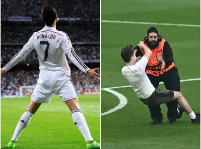 cristiano ronaldo s signature siuu mimicked in pitch invasion at champions league final