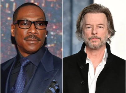 eddie murphy reflects on past struggles with racism and his feud with david spade