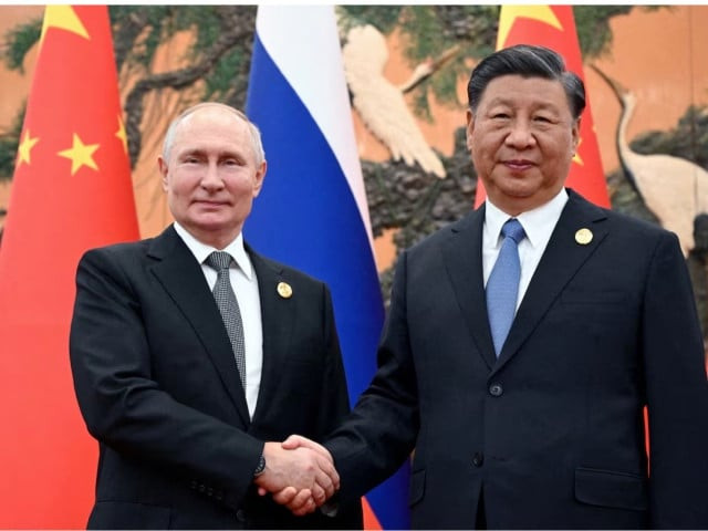 defying west russia s putin set to meet xi jinping in beijing defying west russia s putin set to meet xi jinping in beijing