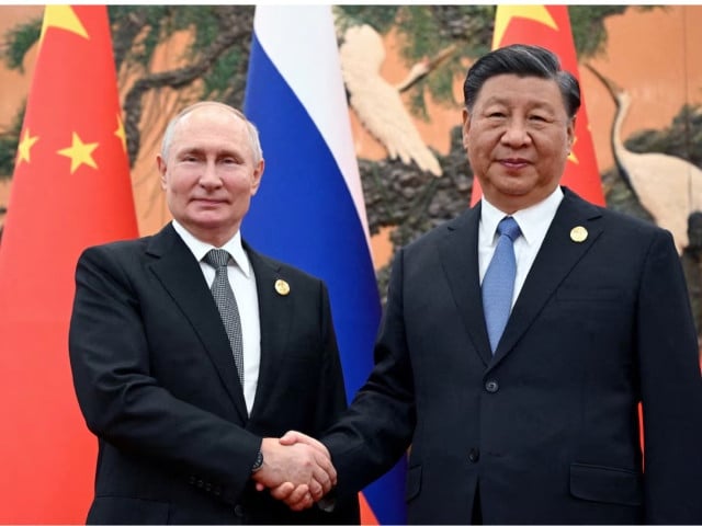russian president vladimir putin shakes hands with chinese president xi jinping during a meeting at the belt and road forum in beijing china october 18 2023 photo reuter