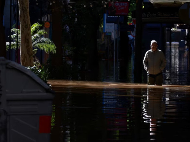 a man walks along a flooded street in the center of porto alegre rio grande do sul brazil may 15 2024 photo reuters