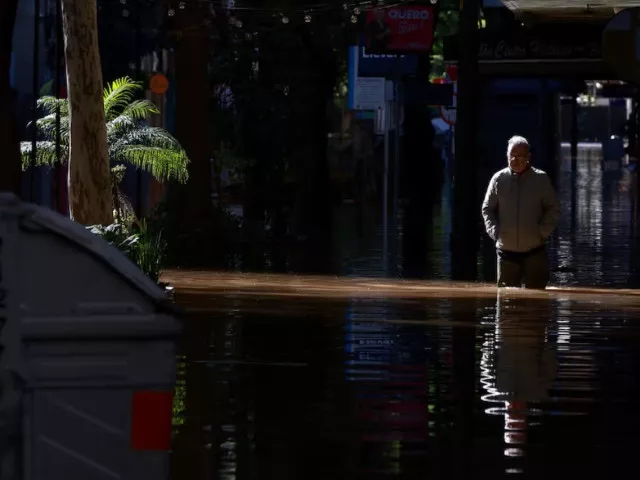 a man walks along a flooded street in the center of porto alegre rio grande do sul brazil may 15 2024 photo reuters a man walks along a flooded street in the center of porto alegre rio grande do sul brazil may 15 2024 photo reuters