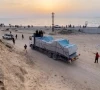 truck carrying aid delivered into gaza via a u s  built pier moves as seen from central gaza strip in this still image taken from a video may 17 2024 photo reuters