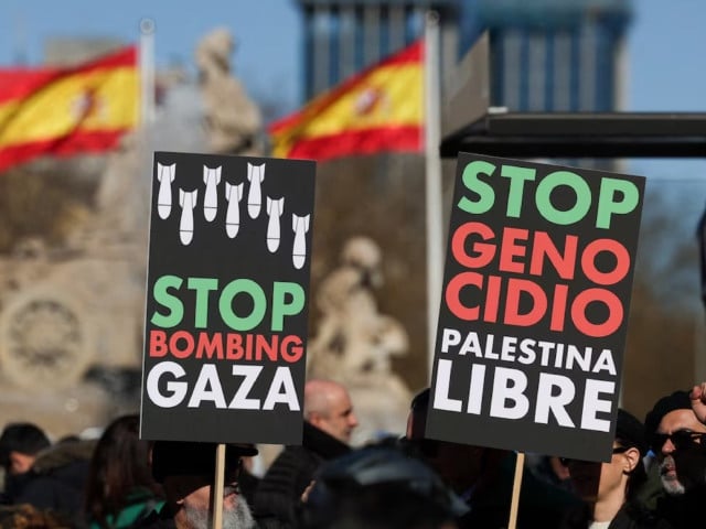 people hold anti war placards during a protest to call for a ceasefire in gaza to mark 100 days since the start of the conflict between israel and the palestinian islamist group hamas in madrid spain january 20 2024 photo reuters