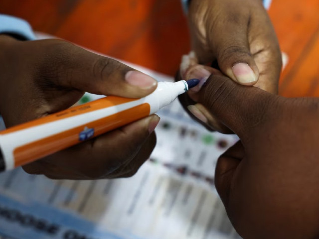 an election worker marks a voter s finger during the south african elections in langa cape town south africa may 29 2024 photo reuters