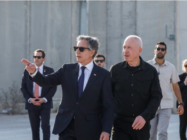 u s secretary of state antony blinken gestures as he walks with israeli defense minister yoav gallant at the kerem shalom border crossing israel may 1 2024 photo reuters