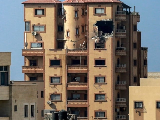 a gaping hole is shown on november 3 2023 in the hajji building which houses agence france presse afp news bureau in gaza city amid the ongoing battles between israel and the palestinian group hamas bashar photo afp a gaping hole is shown on november 3 2023 in the hajji building which houses agence france presse afp news bureau in gaza city amid the ongoing battles between israel and the palestinian group hamas bashar photo afp