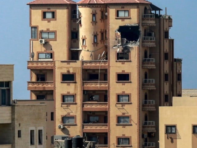 a gaping hole is shown on november 3 2023 in the hajji building which houses agence france presse afp news bureau in gaza city amid the ongoing battles between israel and the palestinian group hamas bashar photo afp