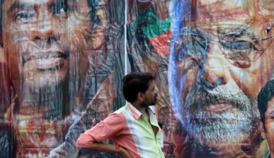 a man stands in front of a poster featuring india s prime minister narendra modi and bharatiya janata party bjp election candidate k annamalai outside its party office in chennai india june 4 2024 photo reuters