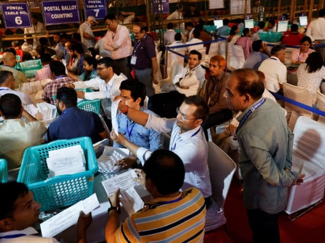 election officials count postal ballots inside a counting centre in new delhi india june 4 2024 photo reuters election officials count postal ballots inside a counting centre in new delhi india june 4 2024 photo reuters