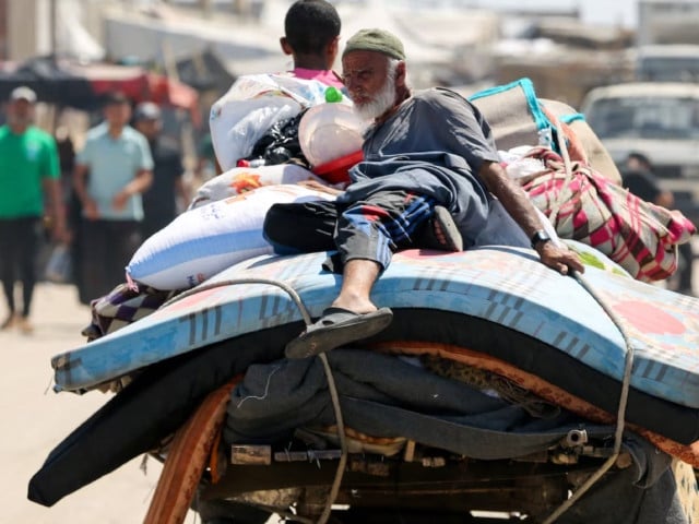a palestinian lies on top of belongings as he flees rafah due to an israeli military operation amid the israel hamas conflict in rafah in the southern gaza strip june 7 2024 photo reuter