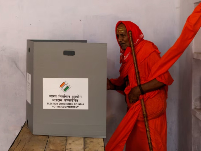 a sadhu or a hindu holy man casts his vote inside a polling station during the seventh and last phase of india s general election in varanasi india june 1 2024 photo reuters